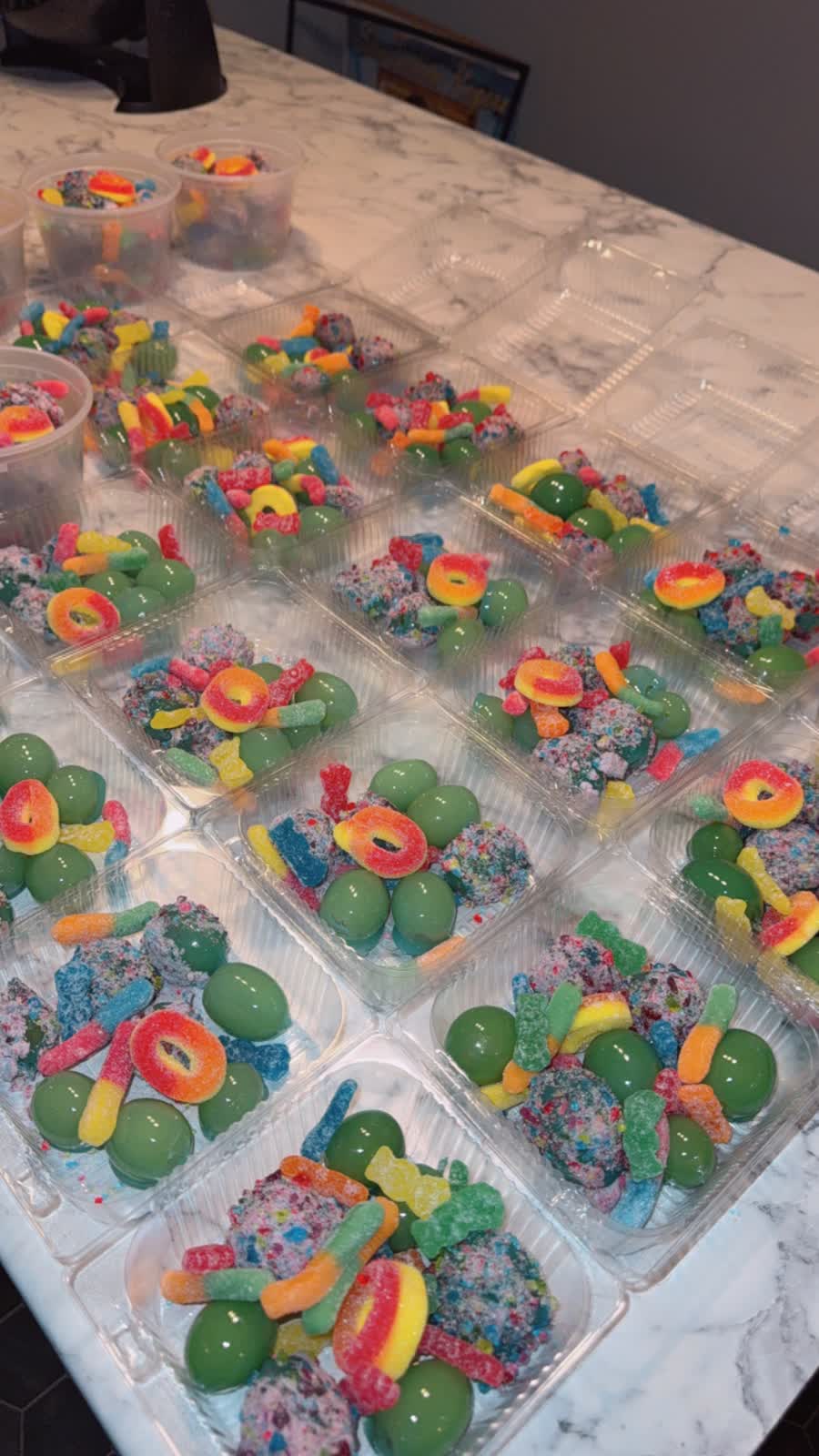 Trays of gummy candy and chocolate treats